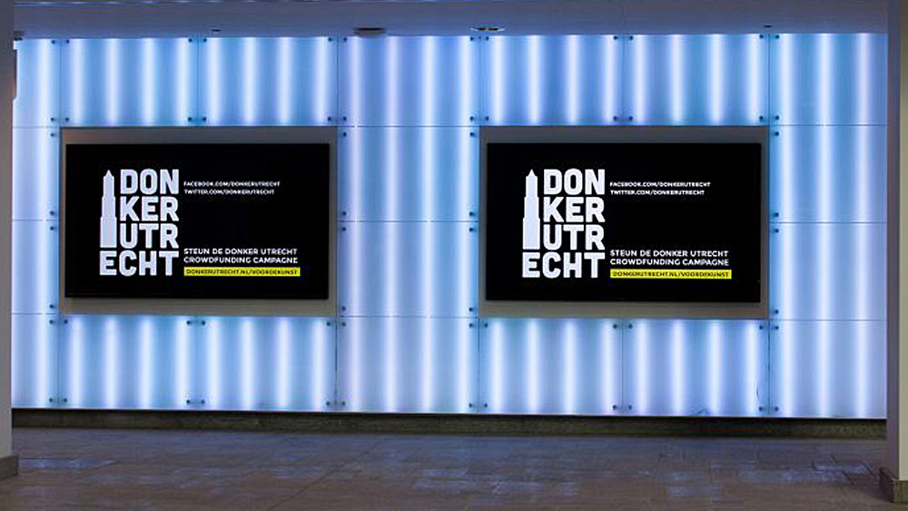 " digital signage displays at wall