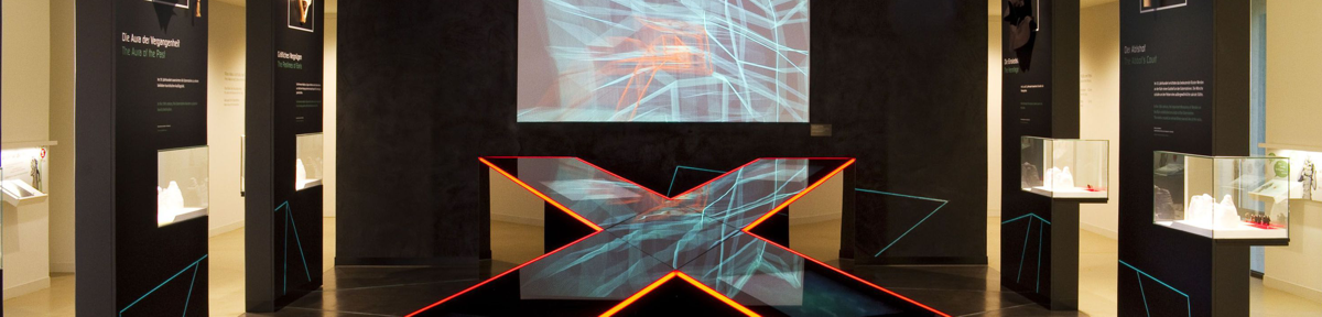 x-shape exhibit with several touchscreens